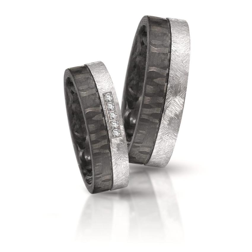 pair of tantalum and forged carbon fibre wedding ring band 6mm wide with 5 diamonds set in the tantalum. brushed finish