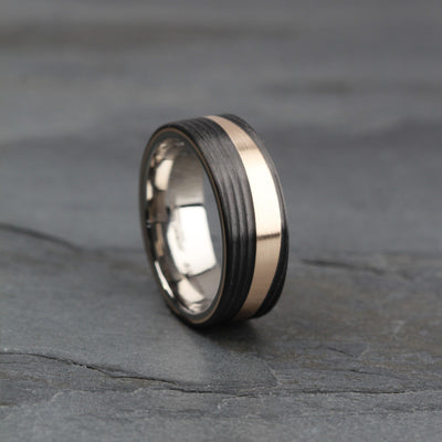 Bronze and black carbon fibre wedding ring band for men. 8mm wide brushed and matt finish. polished titanium sleeve. free engraging inside