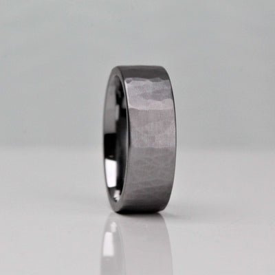 7mm wide gunmetal grey mens wedding ring. Made of Tantalum with a hammered and brushed finish