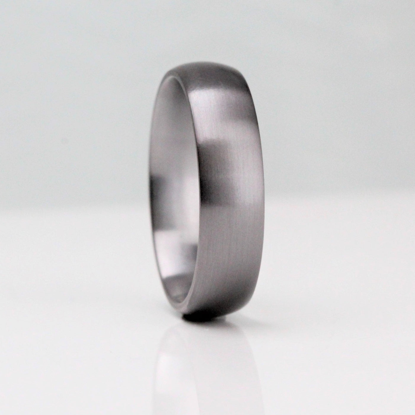 Classic court shape Tantalum wedding ring. 6mm wide in a brushed finish