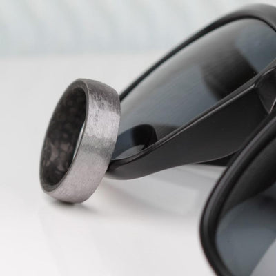 mens tantalum and forged carbon fibre wedding ring band with a brushed textured finish in 7mm wide