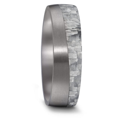 An unusual wedding ring in Tantalum and carbon fibre. The yin and yang ring gives a wave effect to this mans wedding ring