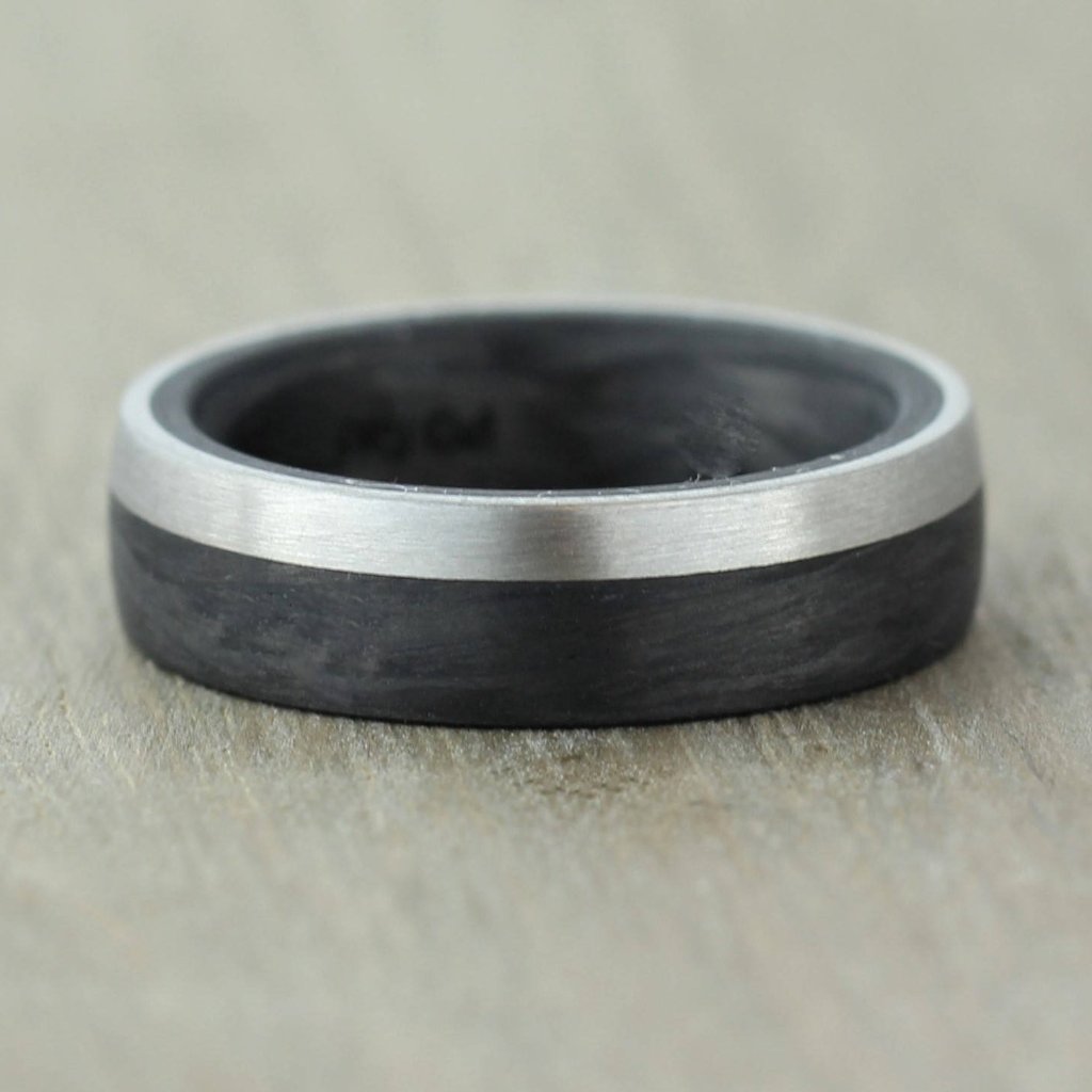 mans black wedding ring band in carbon fibre with a side inlay of palladium