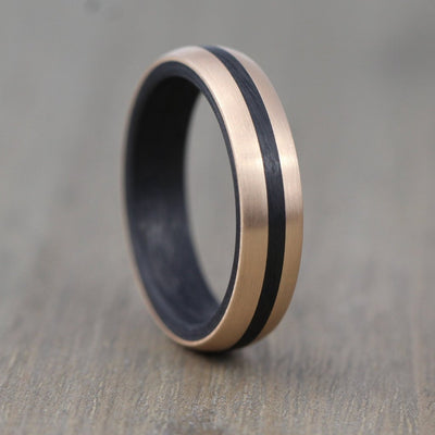 Rose gold and black carbon fibre wedding ring